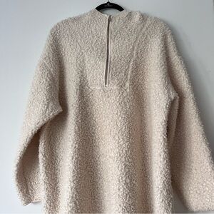 Oversized boucle hoodie with a half zip.